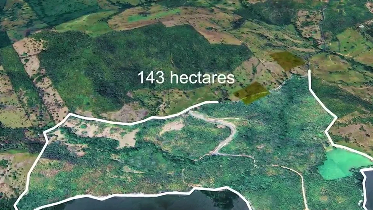 Satellite map showing the 143-hectare approved parcel boundary
