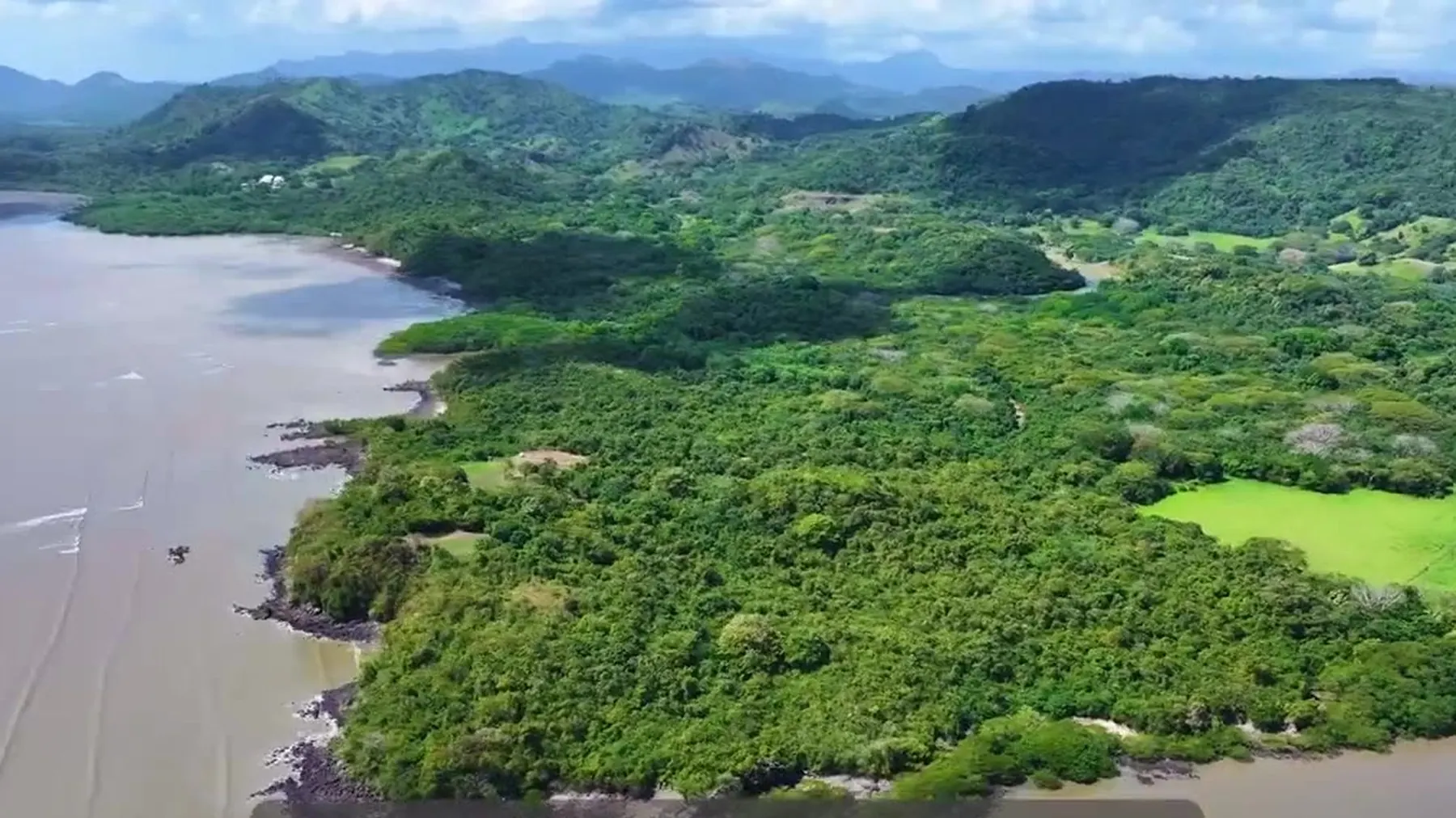 Sweeping aerial view of the Epic Ocean Club coastline and bay